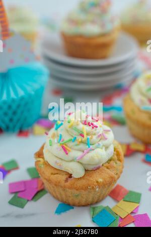sprinkled vanilla cupcakes Stock Photo