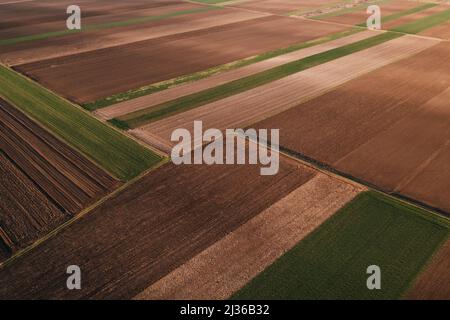 Aerial view of tilled fields in spring from drone pov Stock Photo