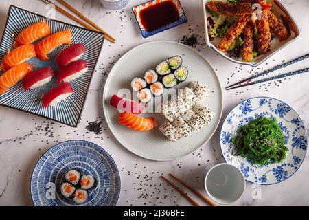 Varied sushi menu and prawn tempura. Stock Photo