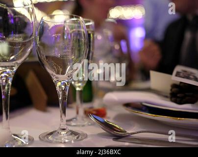 Restaurant table ready for dinner guests Stock Photo
