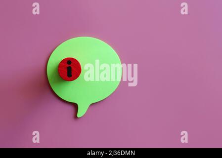 Top view image of wooden cube with information icon on speech bubble with copy space for text Stock Photo