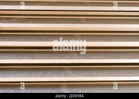 The walls are paneled in beige stripes. Background of city building elements. Stock Photo