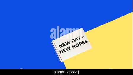 Inspirational and motivational quote on a yellow and blue background like the flag of Ukraine. New day, new hope. Stock Photo