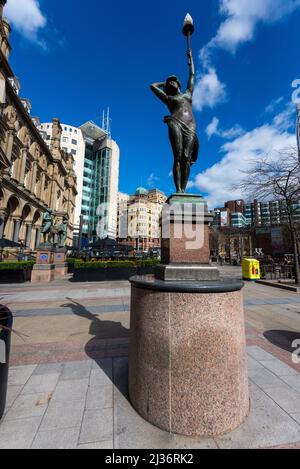 Leeds City Square with one of the Nymph statues by Alfred Drury, she is one of the Nymphs called Even with her hand to her head the others being Morn. Stock Photo
