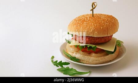 Vegan burger. Based on soy flour and wheat protein. Cheese based on coconut oil. Stock Photo