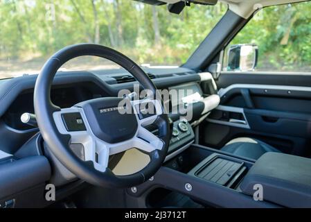 Russia, Rostovskaya oblast, 2021 June 09: Steering wheel of Land Rover Defender is a four-wheel drive off-road SUV from British automotive company Jag Stock Photo