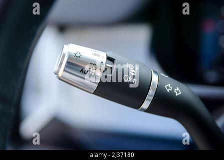 Headlight and fog-lamp controlling stick in car. The switch of light of headlights. Stock Photo