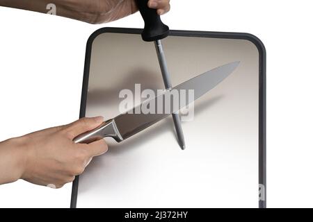 Various kitchen knives, scissors and cutting board Stock Photo