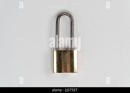 Steel tall padlock isolated on white background, locked padlock, solid safety top view Stock Photo