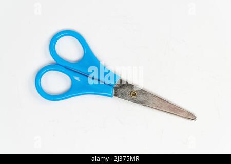 Blue scissors isolated on white background, small a pair of scissors, cutting tool top view Stock Photo