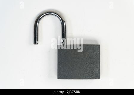 Steel tall padlock isolated on white background, unlocked padlock, solid unsafety top view Stock Photo
