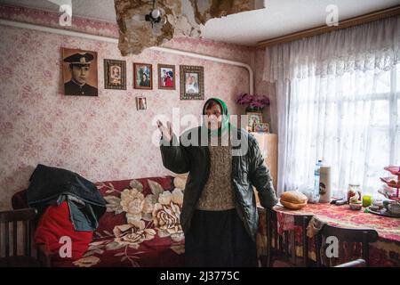 Borodyanka, Ukraine. 05th Apr, 2022. An elderly woman inside her house in Irpin, which was damaged by shelling. Russia invaded Ukraine on 24 February 2022, triggering the largest military attack in Europe since World War II. (Photo by Laurel Chor/SOPA Images/Sipa USA) Credit: Sipa USA/Alamy Live News Stock Photo