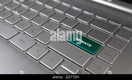 Keyboard with donate text on the enter button, online streamer donate idea, concept of signs, grey keypad close up, front view, selective focus Stock Photo