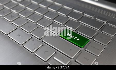 Keyboard with play text on the enter button, gaming term idea, concept of play, grey keypad close up, front view, selective focus Stock Photo