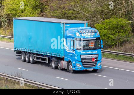 R Barkley & Sons Ltd DAF XF curtain-sided lorry ,curtainsider, tautliner, curtainsided, curtainside trailers driving on the M61 in Manchester, UJK Stock Photo