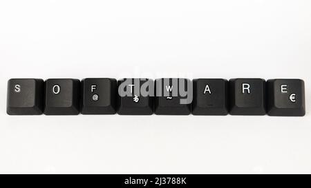 Software text created with keyboard keys isolated on white background, white software on black keyboard, top view Stock Photo