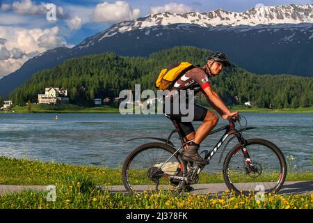 MTB mountain bike cycling and the mountain lake of St. Moritz in the summer time, Sankt Moritz, Engadin, Grisons, Switzerland. Stock Photo