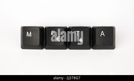 Meta text created with keyboard keys isolated on white background, white meta on black keyboard, top view Stock Photo
