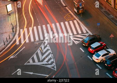 Prague, Czech Republic. Top View Of Road Marking A Pedestrian Crossing And Parked Cars On The Hybernska Street. Light Traffic Trails.