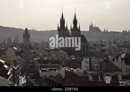 Historic towers and rooftops, hazy day in Prague Czech Republic.