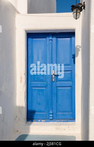 Blue Greek door. Pyrgos village on Santorini island, Greece Stock Photo