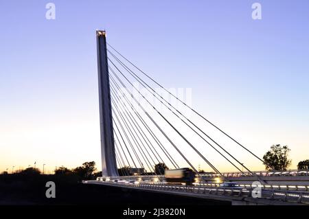 Modern Puente del Alamillo, cable-stayed bridge at dusk in Seville Andalusia Spain. Designed by Santiago Calatrava architect. Stock Photo