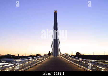 Modern Puente del Alamillo bridge pedestrian walkway at dusk in Seville Andalusia Spain. Designed by Santiago Calatrava architect. Stock Photo