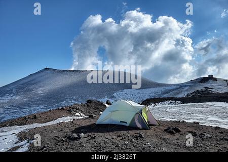 wild camp on volcanic rock in winter Etna Park, Sicily Stock Photo