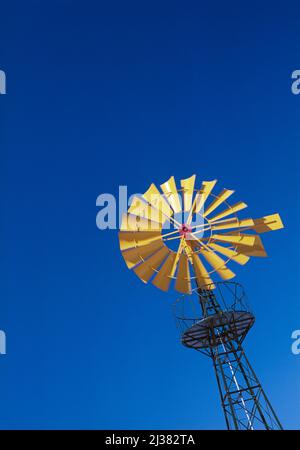 Yellow windmill against a blue background, Spain Stock Photo