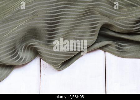 A soft olive green fabric background. Graphic resources Stock Photo