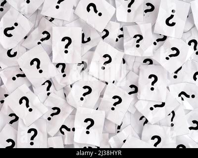 A lot of crumpled paper notes with question marks. Black and White. Full frame Stock Photo