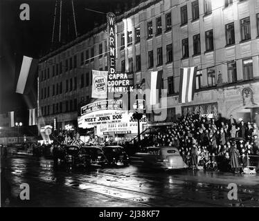 Los Angeles Premiere at the Warner Theatre on Hollywood Boulevard on March 12th 1941 of GARY COOPER and BARBARA STANWYCK in MEET JOHN DOE 1941 director FRANK CAPRA based on story by Richard Connell and Robert Presnell screenplay Robert Riskin Frank Capra Productions / Warner Bros. Stock Photo