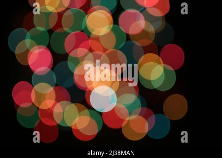 Defocused colorful lights on black background. Stock Photo