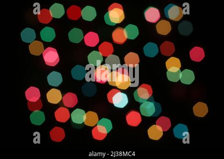 Defocused colorful lights on black background Stock Photo