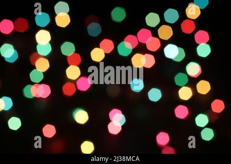 Defocused colorful lights on black background Stock Photo