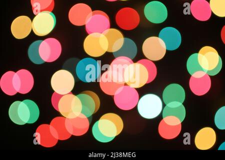 Defocused colorful lights on black background Stock Photo