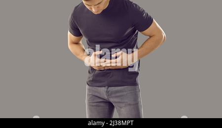 Sick man touch belly struggle with stomachache Stock Photo