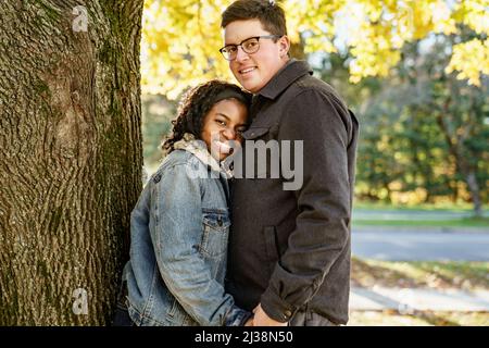 Romantic Teenage Couple In Autumn Park outside Stock Photo