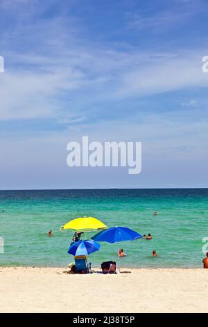 MIAMI, USA - JULY 31, 2010: umbrellas at the beautiful beach for sun protection Stock Photo