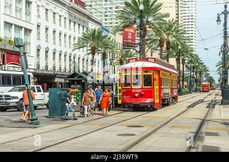 NEW ORLEANS - JULY 16, 2013: people travel with the old Street car Canal street line St. Charles line  in New Orleans, USA.  It is the oldest continua Stock Photo