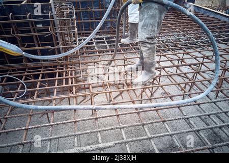 Workers compact concrete Stock Photo