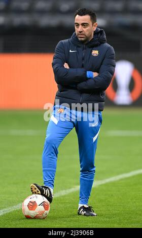 06 April 2022, Hessen, Frankfurt/Main: FC Barcelona head coach Xavi Hernandez watches his team's final training session ahead of the Europa League first leg at Eintracht Frankfurt. Photo: Arne Dedert/dpa Stock Photo