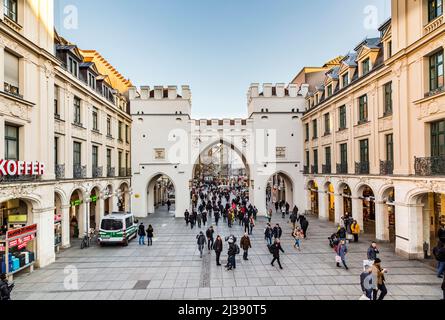 Munich, Germany - NOV 29, 2016: People walking along through the Karlstor gate in Munich, Germany. Stock Photo