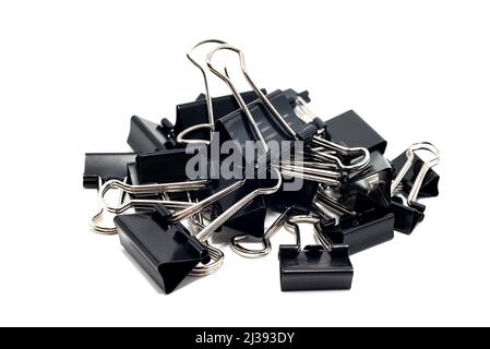 Black binder clip. Paper clips on a white background. Stationery Stock Photo