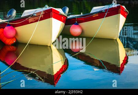 A pair of dinghies in Roundstone harbour, Connemara, County Galway Ireland. Stock Photo