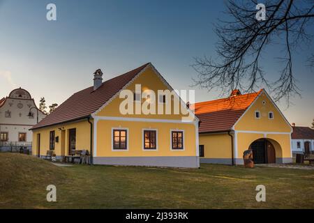Holasovice village in spring sunny color nice evening with old folks houses Stock Photo