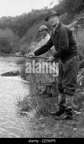 Lord Londonderry's Angling Holiday In The North -- Lord Londonderry, in shorting attire, fishing on the banks of the Brora River. Lord Londonderry, in shorting attire, fishing on the banks of the Brora River. Lord Londonderry, Ex-Air Minister, is at present spending a fishing holiday at Brora, Sutherland, where he is fishing the Brora river. Owing to the exceptionally bright weather, angling conditions have not been ideal for good sport. April 11, 1938. (Photo by Keystone). Stock Photo