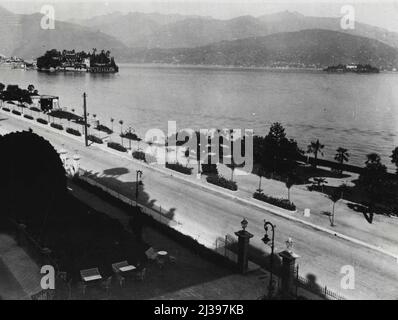 Where Vital Conference Will Be Held -- A Picturesque view form Stresa Italy, where the important conference opens tomorrow. On left is Isola Bella one of the most beautiful islands on Lake Maggiore, and where the conference will be held. April 10, 1935. (Photo by London News Agency Photos Ltd.). Stock Photo