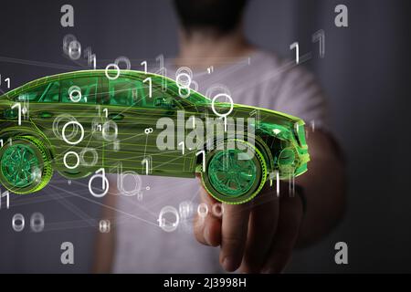 An illustration of a Man holding and touching a holographic smart car Stock Photo