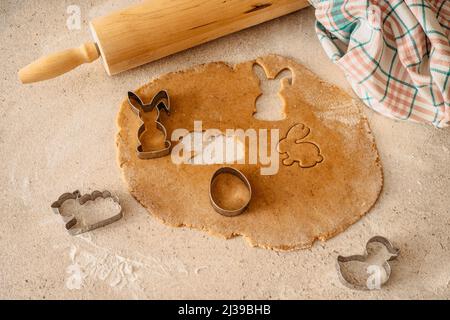 Easter baking flat lay.Spring symbols made from gingerbread.Homemade cookies.Easter bunny,rabbit,eggs and ducks from delicious honey dough. Stock Photo